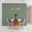 Modern Sage Green Wallpaper in bright living room setting with minimal furniture