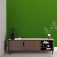 Modern green wallpaper in a bright living room setting showing depth and texture