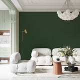 Forest green wallpaper in a bedroom creating a calm and peaceful atmosphere