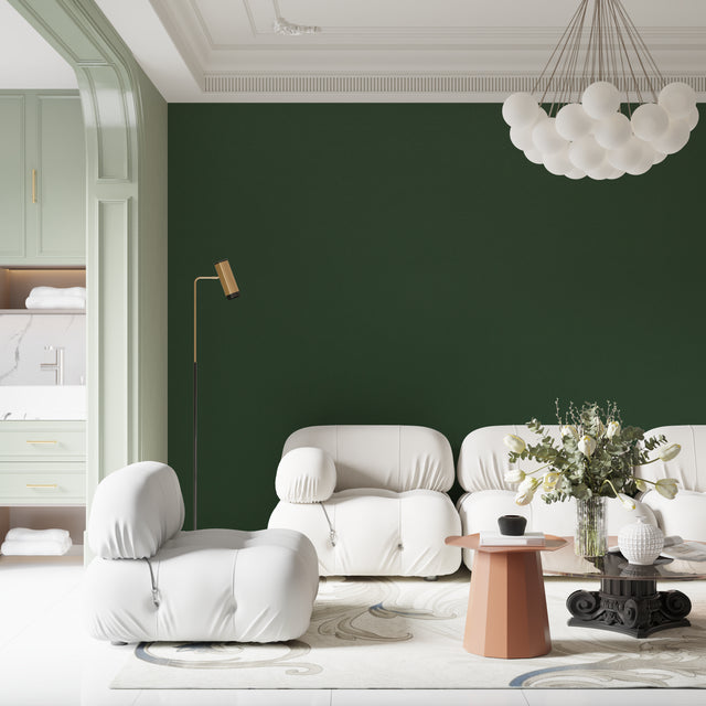 Modern emerald green wallpaper in a bright living room setting, showing how the solid color creates depth