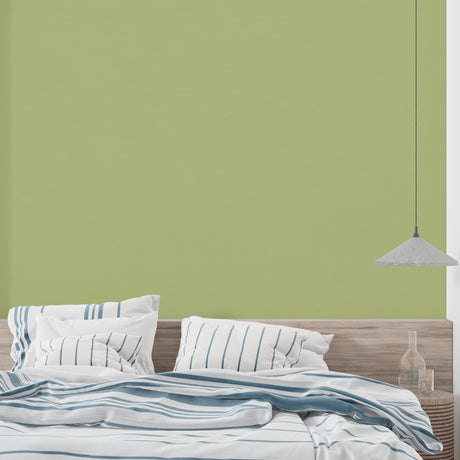 Green bamboo wallpaper creating a serene atmosphere in a modern living room with natural light
