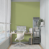 Soft green wall mural bringing calm to a minimalist bedroom setting