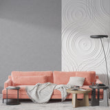 Minimalist grey mural in entrance hall demonstrating elegant simplicity