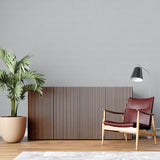 Grey minimalist wallpaper enhancing an urban apartment entrance