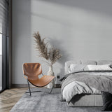 Minimalist grey wallpaper installation in a stylish home office space
