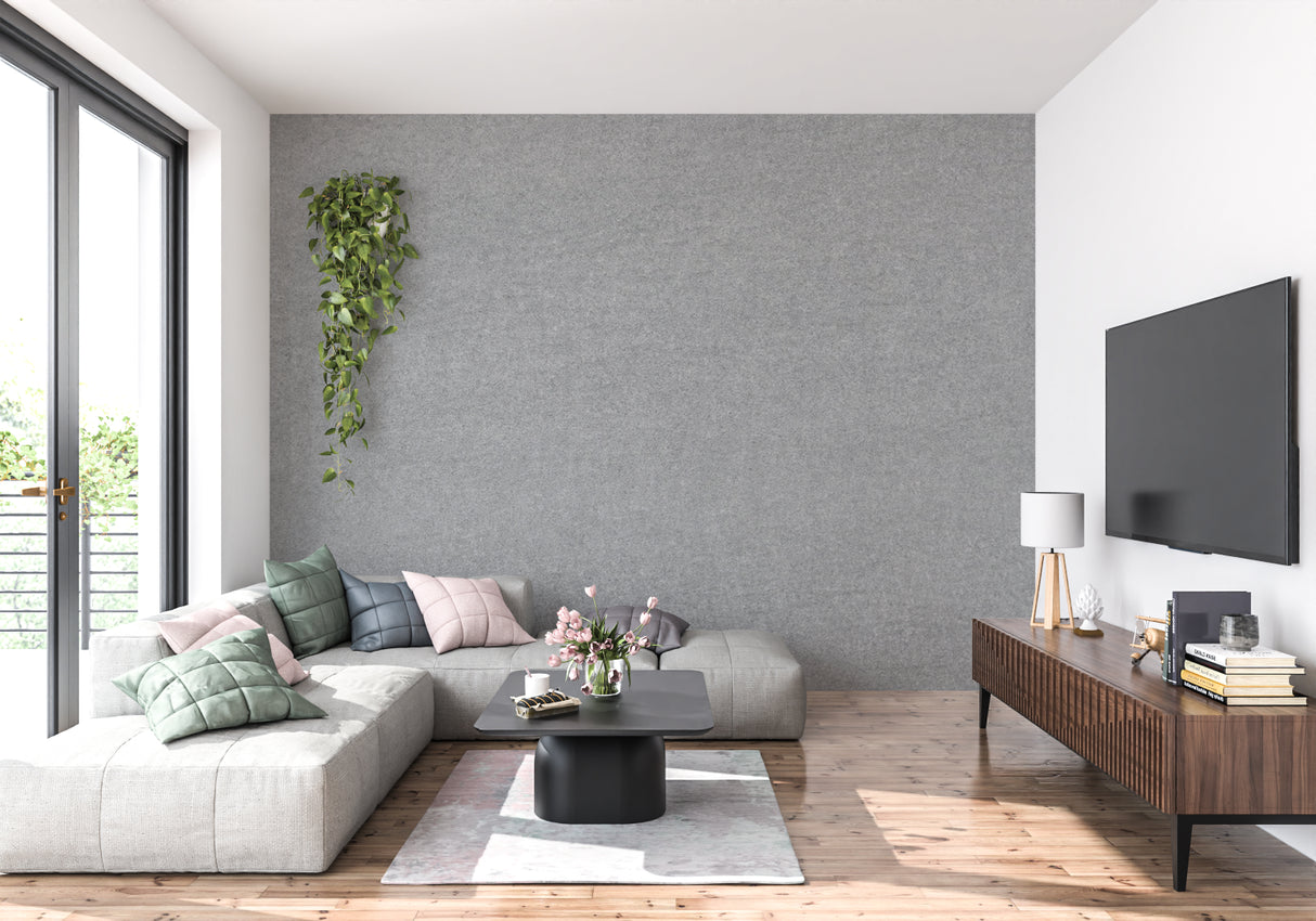 Modern grey textured wallpaper in a bright living room setting with minimal furniture