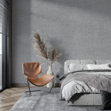 Grey textured wall mural creating depth in a modern bedroom space
