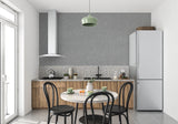 Modern grey wallpaper adding texture to a minimal dining room