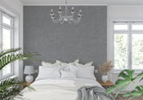Textured grey mural wallpaper in an elegant entryway setting