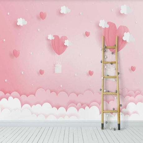 Pink heart wallpaper with floating clouds creating a dreamy atmosphere in a modern nursery setting