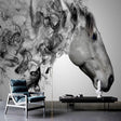 Black and white horse wallpaper creating drama in a modern living room with grey sofa and minimal decor