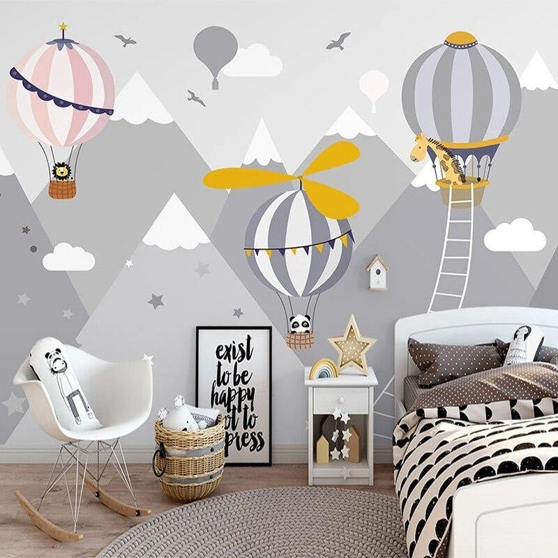 Nursery wall mural featuring floating balloons and cute animals in a modern baby room