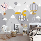 Nursery wall mural featuring floating balloons and cute animals in a modern baby room