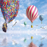 Hot air balloon design file showing detailed pattern of floating house and colorful balloons in fantasy sky