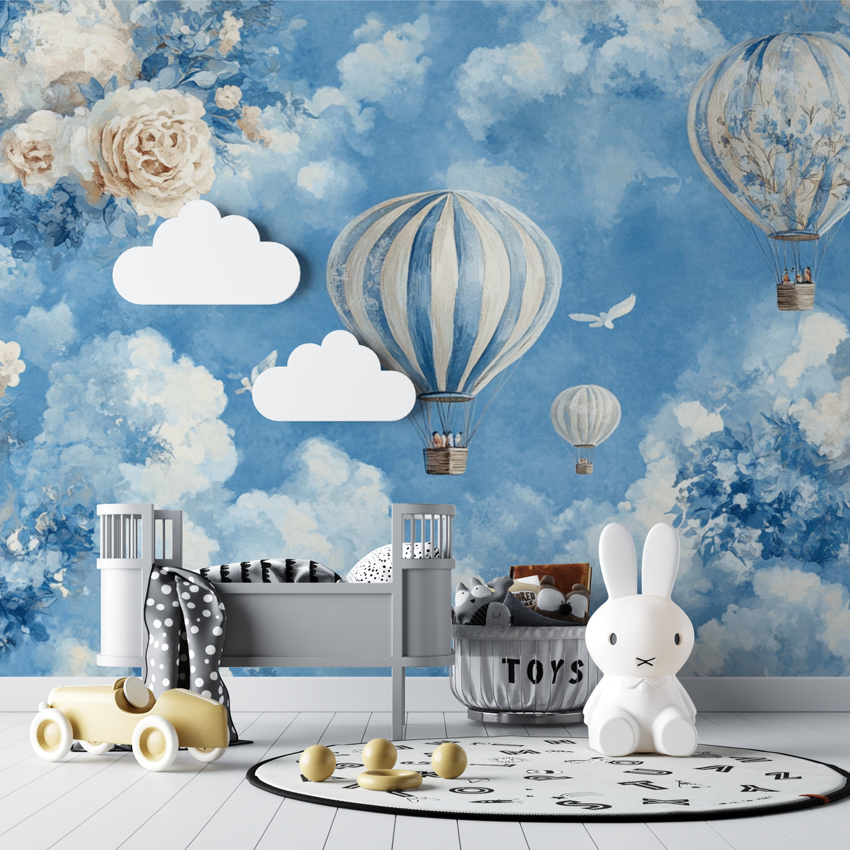 Hot air balloon nursery wallpaper creating a magical atmosphere in a bright, modern nursery with white furniture