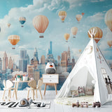 Living room decorated with hot air balloon city mural in soft, calming tones