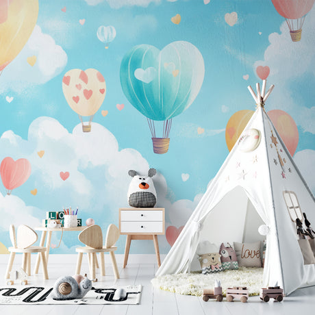 Hot air balloon wallpaper creating a magical atmosphere in a bright nursery with white furniture