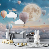Night sky balloon mural transforming a child's bedroom into a dreamy wonderland