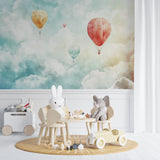 Dreamy balloon wallpaper adding charm to a baby's sleeping area