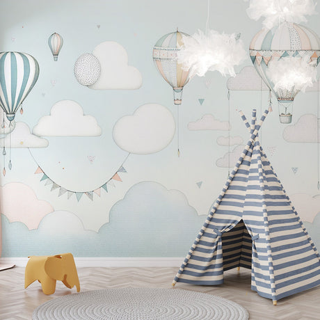 Hot air balloon wallpaper brings whimsy to a bright nursery, with soft pastel colors creating a dreamy atmosphere