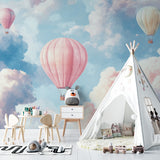 Dreamy balloon wallpaper bringing sky views to a cozy reading nook