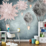 Hot air balloon nursery wallpaper creating a magical atmosphere in a modern baby's room with soft pink and grey tones