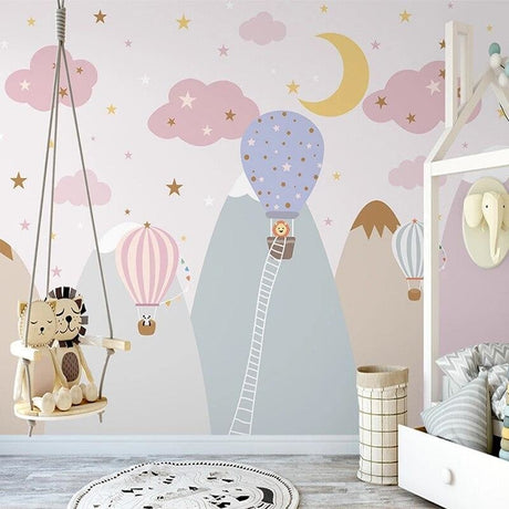Pink hot air balloon nursery wallpaper creating a magical atmosphere in a modern baby room with white furniture