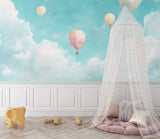 Balloon wall mural in baby room with crib showing calming effect
