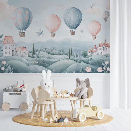 Hot air balloon nursery wallpaper creating a soft, dreamy atmosphere in a baby girl's room with pink and white furniture