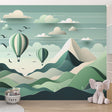 Hot air balloon wallpaper in a bright nursery, showing three mint-green balloons floating over mountains creating a peaceful atmosphere