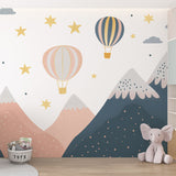 Hot air balloon nursery wallpaper creating a dreamy atmosphere in a modern nursery with soft lighting