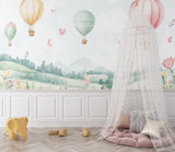 Hot air balloon wallpaper transforming a girl's bedroom with its magical sky scene