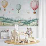 Butterfly and balloon wall mural adding whimsy to a peaceful playroom setting