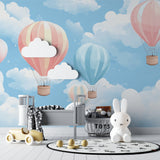 Pastel balloon mural creating depth in a cozy reading nook with natural lighting