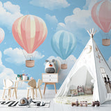 Sky theme wallpaper adding depth to a small bedroom with minimal decor