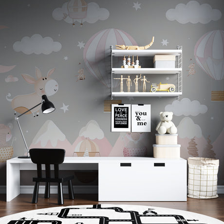Pink hot air balloon nursery wallpaper in modern baby room with white crib and natural lighting