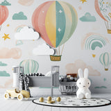 Rainbow balloon wallpaper making a statement in a modern children's bedroom