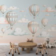 Hot air balloon nursery wallpaper creating a magical atmosphere in a cozy bedroom, with soft pastel colors and floating clouds