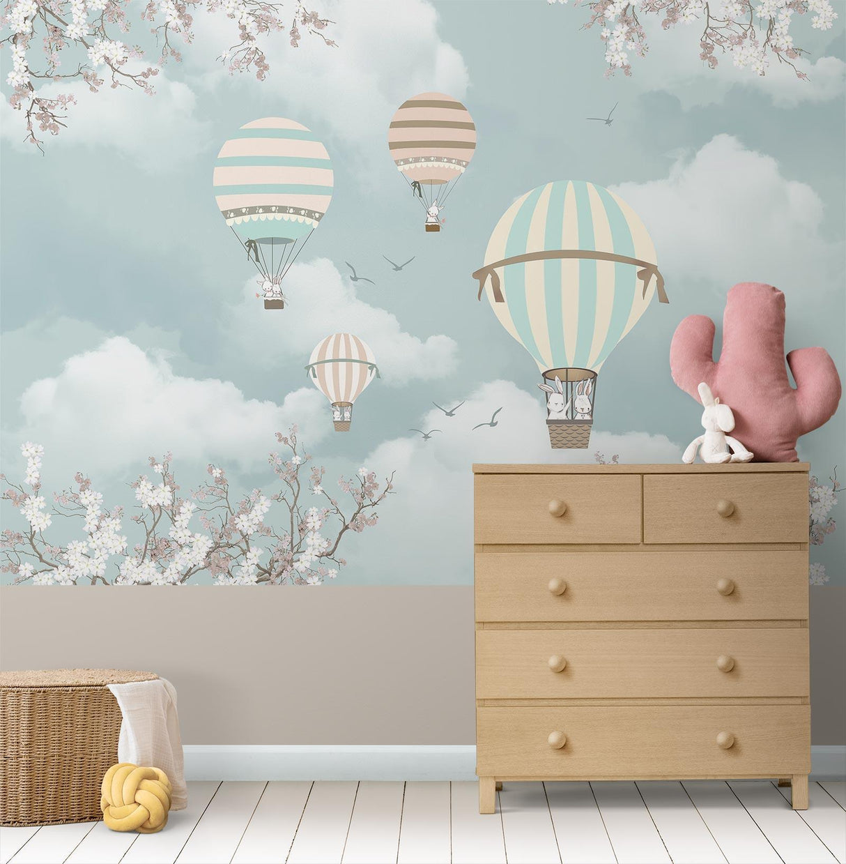 Balloon and cherry blossom mural displayed in a child's reading nook with cozy cushions