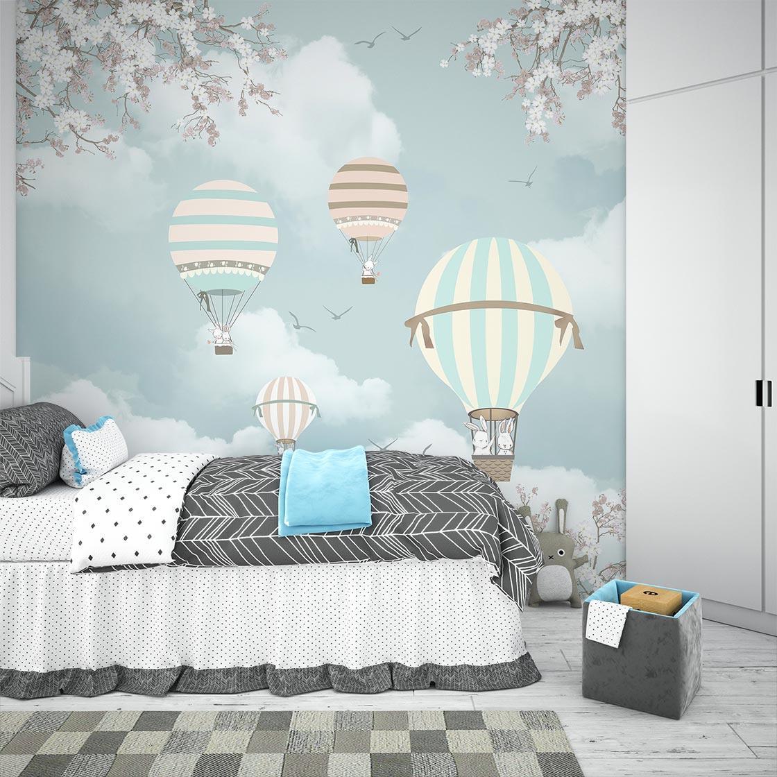 Hot air balloon wall design transforming a baby's room into a dreamy sky garden
