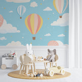 Hot air balloon nursery wallpaper in a bright nursery, creating a dreamy atmosphere with pastel colors and floating balloons