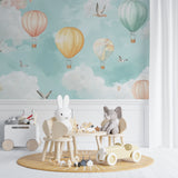 Pastel balloon wallpaper creating a peaceful atmosphere in a child's reading nook