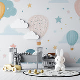 Playroom wall with hot air balloon wallpaper, modern furniture and educational toys showing scale