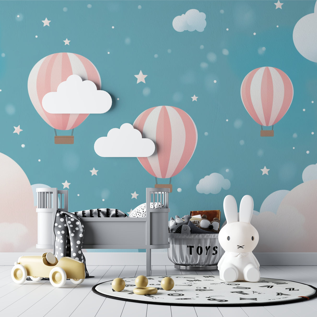 Hot air balloon nursery wallpaper creating a dreamy atmosphere in a modern white nursery with wooden furniture