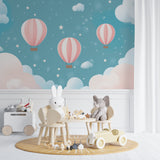 Hot air balloon mural in a baby girl's nursery, creating a peaceful sleeping environment