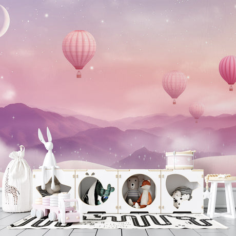 Pink hot air balloon wallpaper creating a magical atmosphere in a cozy nursery with soft lighting