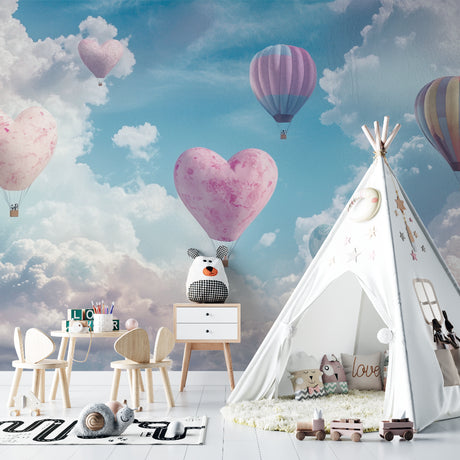 Heart shaped hot air balloon wallpaper in a bright nursery with white furniture and soft pink accents