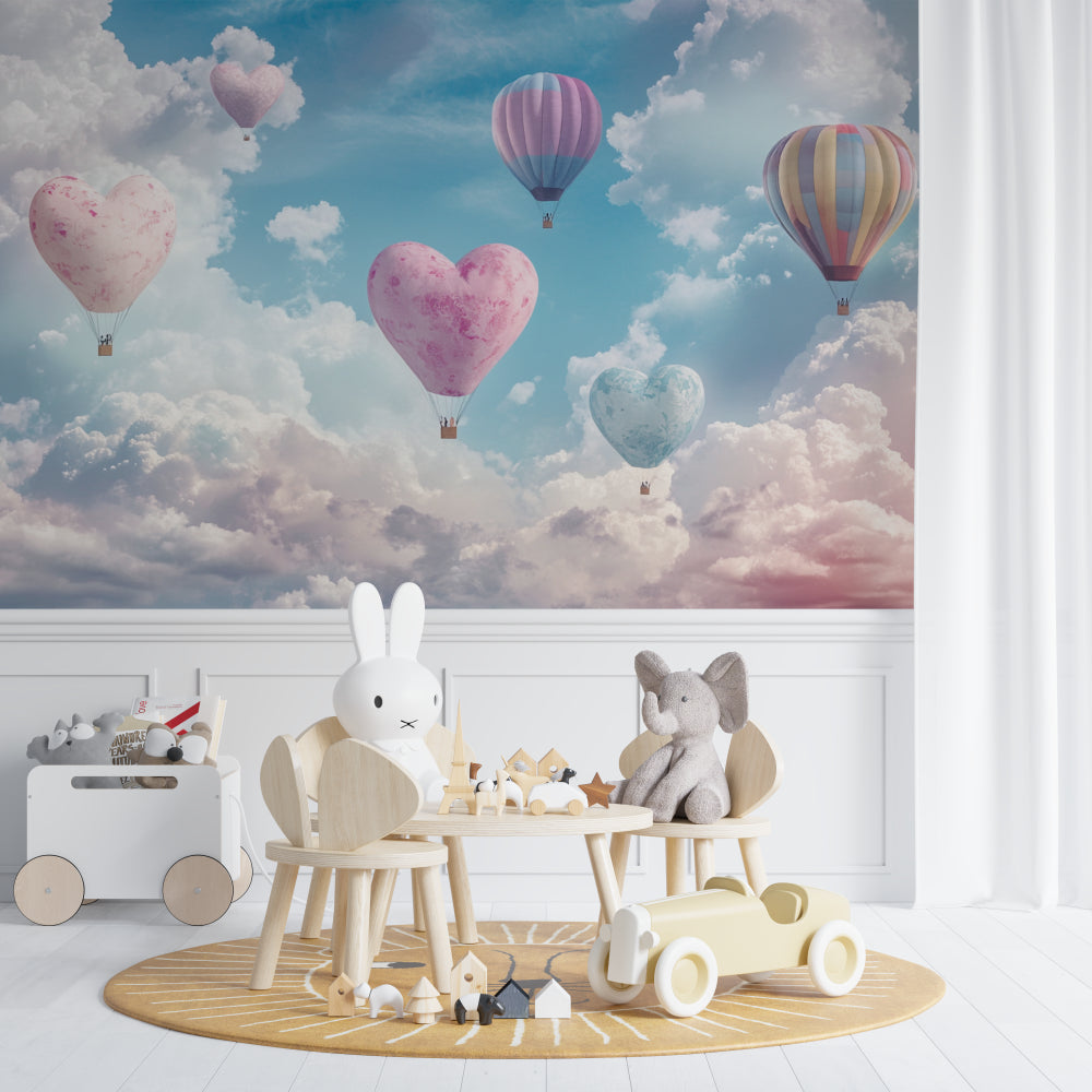Heart balloon wall mural in a baby's room with rocking chair and mobile