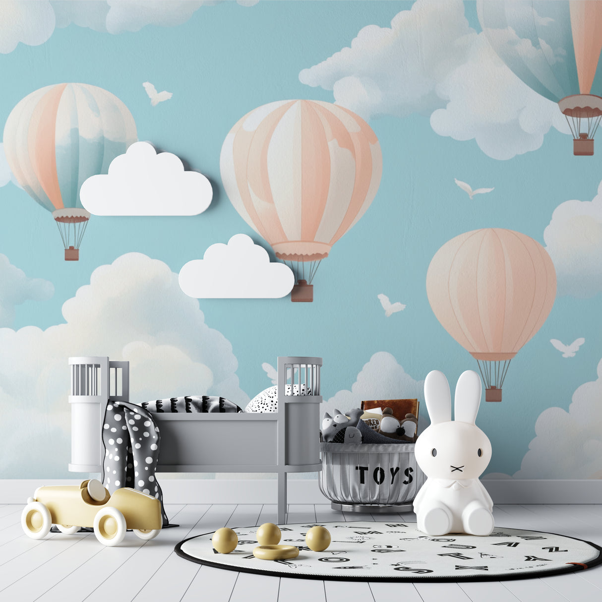 Hot air balloon nursery wallpaper in a modern white nursery, creating a soft and dreamy atmosphere