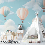 Pink hot air balloon wallpaper bringing charm to a little girl's bedroom with white furniture